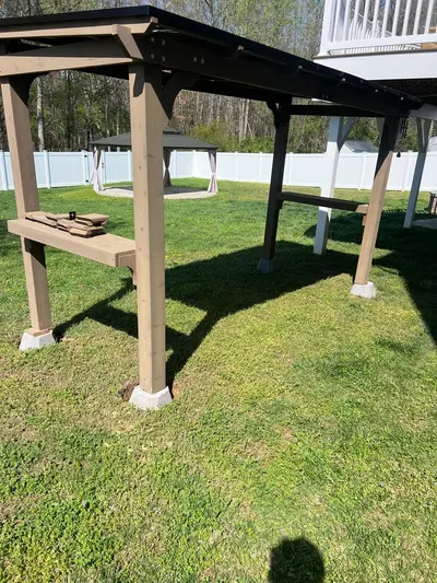 Completed pergola structure with bench seating