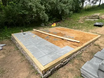 Pavers partially laid over the gravel base
