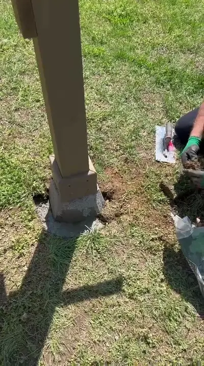 Setting a post footing during pergola assembly